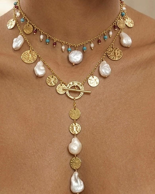 Pearl necklace with turquoise and ruby.